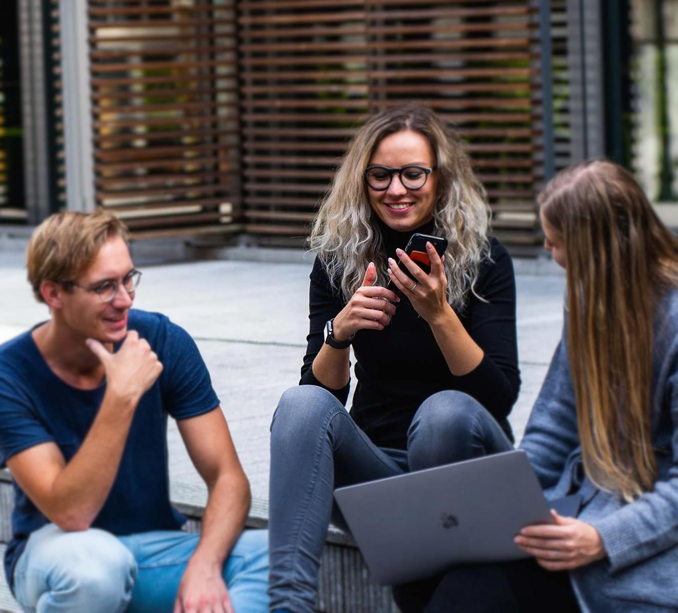 Hands holding a tablet which is displaying a speed gauge